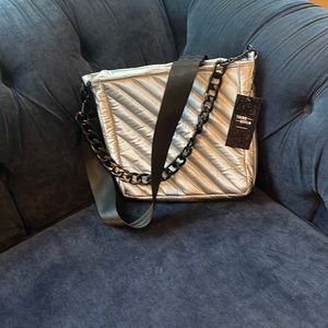 The Cloud Bag has an open tote space, slip pocket outside and crossbody option.